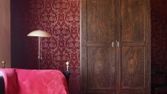 About 100 years old wooden cabinet in the red room. About 100 years old wooden cabinet in the red room.